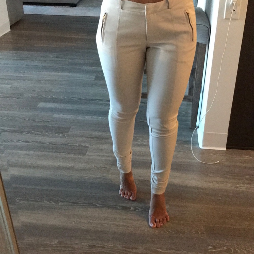 Taupe slacks with gold zippers